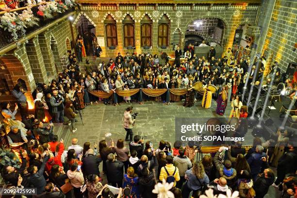 Participants of the Newroz celebration are seen watching a tambourine concert by Kurdish women musicians. Hundreds of women joined the Newroz Day...