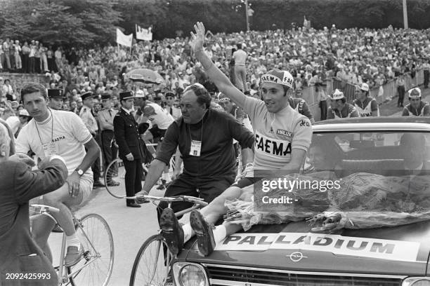 Belgian Cycling runner Eddy Merckx greets the public on July 20, 1969 at the velodrome Jacques-Anquetil at Paris after winning the 1969 French...