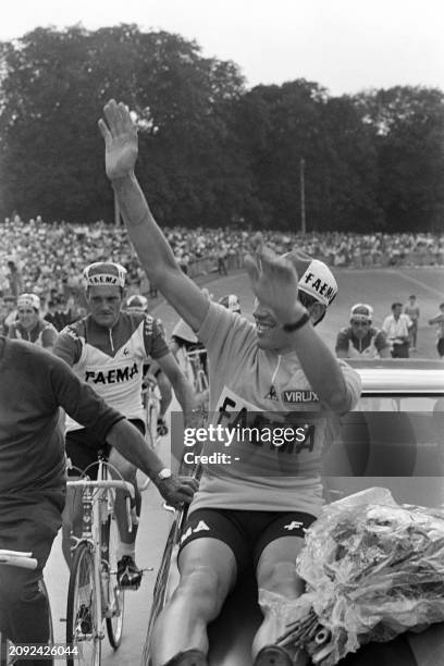 Belgian Cycling runner Eddy Merckx greets the public on July 20, 1969 at the velodrome Jacques-Anquetil at Paris after winning the 1969 French...