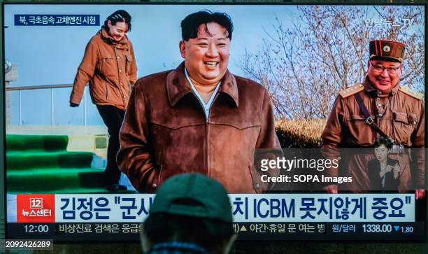 South Korea's 24-hour YonhapnewsTV shows North Korean leader Kim Jong Un smiling after overseeing a ground jet test of a solid-fuel engine for a...