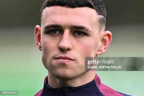 England's midfielder Phil Foden takes part in a team training session at St George's Park in Burton-on-Trent, central England, on March 20, 2024...