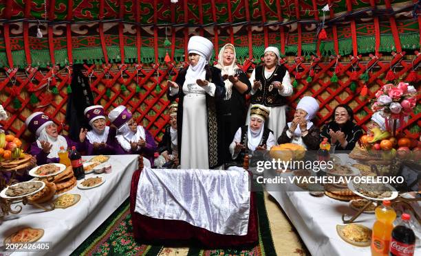 Performers wearing traditional costumes take part in the celebrations of Nowruz in Bishkek on March 20, 2024. Nowruz, "The New Year" in Farsi, is an...