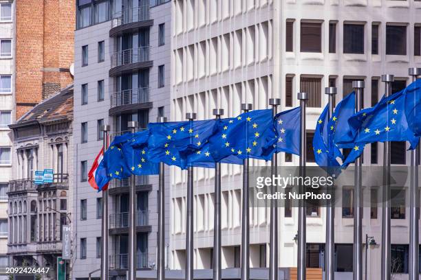 Flags of Europe as seen waving on pole. The European Flag is the symbol of Council of Europe COE and the European Union EU as seen in the Belgian...