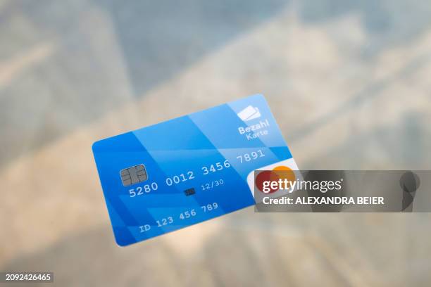 This photo taken on March 20, 2024 shows a prepaid benefit card for asylum seekers that will be valid in the German state of Bavaria during a press...