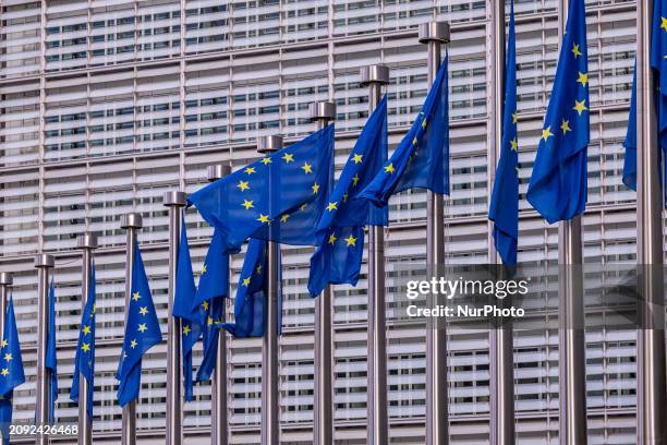 Flags of Europe as seen waving on pole. The European Flag is the symbol of Council of Europe COE and the European Union EU as seen in the Belgian...