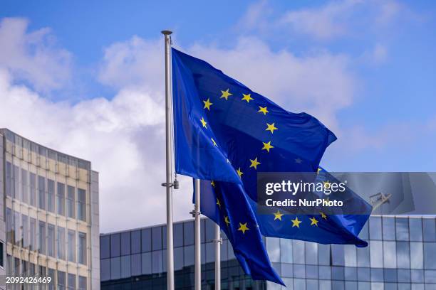 Flags of Europe as seen waving on pole. The European Flag is the symbol of Council of Europe COE and the European Union EU as seen in the Belgian...