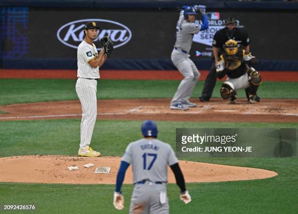 San Diego Padres' pitcher Yu Darvish looks at Los Angeles Dodgers' Shohei Ohtani during the third inning of the 2024 MLB Seoul Series baseball game...