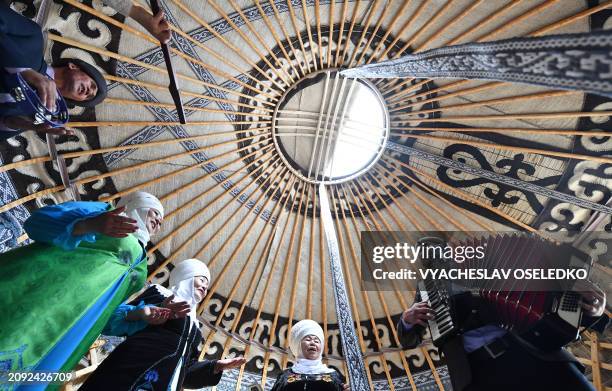 Performers wearing traditional costumes take part in the celebrations of Nowruz in Bishkek on March 20, 2024. Nowruz, "The New Year" in Farsi, is an...