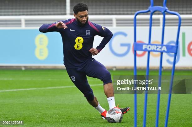 England's defender Joe Gomez takes part in a team training session at St George's Park in Burton-on-Trent, central England, on March 20, 2024 ahead...