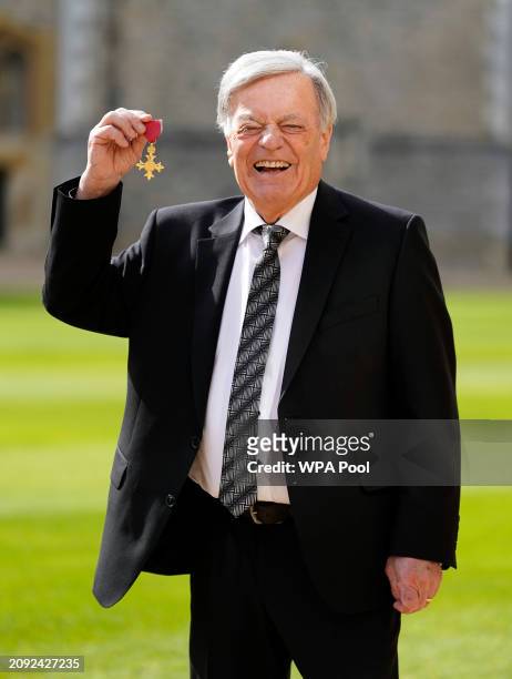 Tony Blackburn after being made an Officer of the Order of the British Empire during an investiture ceremony at Windsor Castle on March 20, 2024 in...