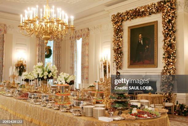 Samples of food to be served during holiday parties line the table in the State Dining Room at the White House in Washington, DC, 29 November 2007....