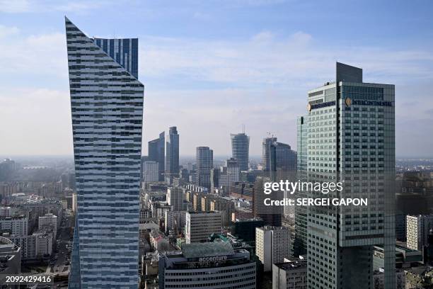 This photograph taken on March 20, 2024 shows a view of the Zlota 44 building , designed by Polish-American architect Daniel Libeskind, among the...
