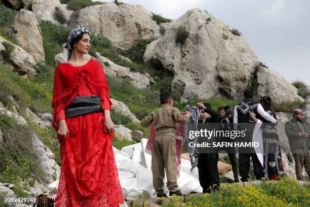 Iraqi Kurdish people celebrate the Nowruz New Year festival in the town of Akre, about 100 kilometres north of Arbil, in Iraq's northern autonomous...