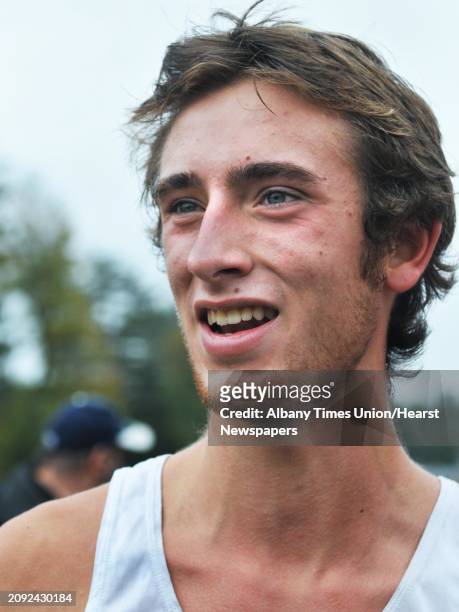 Burnt Hills' Otis Ubriaco speaks to reporters after winning the Boys Class A race during the Section II cross country championship meet at Saratoga...
