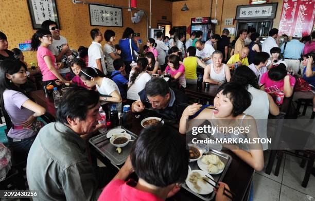 Chinese diners crowd the Yaoji Chaogan restaurant, after the restaurant's popularity soared due to US Vice President Joe Biden's impromptu meal there...