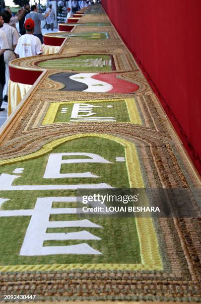 The Arabic word "Syria" appears on a mosaic of traditional Arabic sweets, measuring 112 meters long, which entered the Guiness Book of World Records...