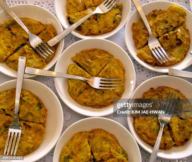 Plates of Kimchi galette are displayed at a French-Korean food exhibition at Le Cordon Bleu Korea in Seoul, 19 Ocotober 2004. The event was part of...