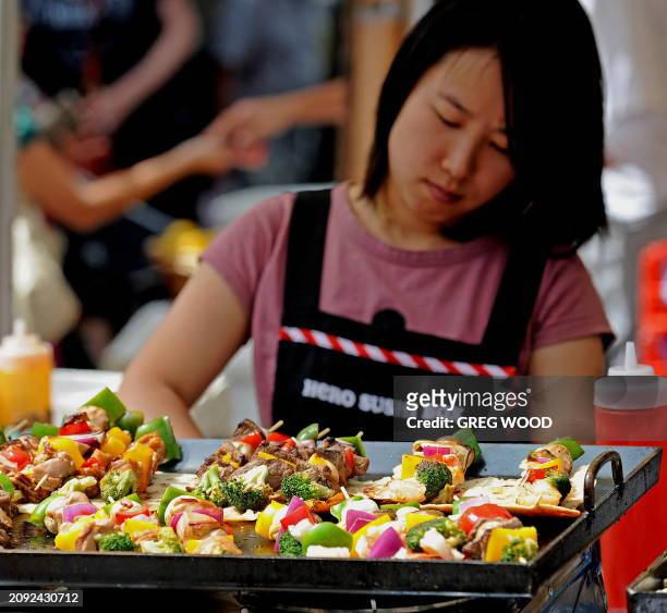 Meat and vegetables on skewers are barbecued at a Rocks Farmer's Market stall in Sydney's historic Rocks precinct on March 13, 2010. The Rocks is...