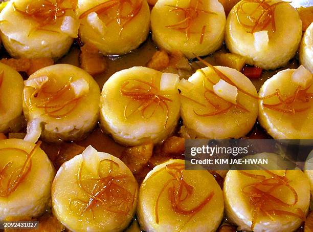 Rice pudding topped with orange-flavared Kimchi are displayed at a French-Korean food exhibition at Le Cordon Bleu Korea in Seoul, 19 Ocotober 2004....