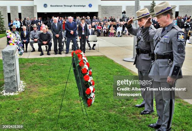 Troop Superindendent Joseph D'Amico and NYSP Police Academy 1st Sgt. Bud Saunders, at right, la a wreath during a memorial ceremony at the New York...
