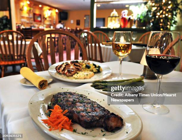 Grilled scallops with remoulade sauce, top, and a Delmonico steak with asparagus at Jack's American Bistro in Queensbury Saturday afternoon April 22,...