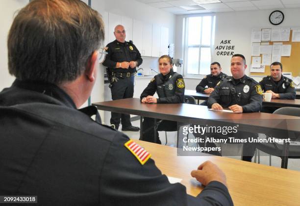 Officer Bud Wyman, left, supervises the change of shift/roll call for members of the Niskayuna Police Department Tuesday Nov. 1, 2011.