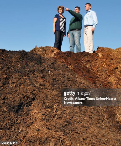 Siblings and co owners, from left, Shannon Sean, and Brendan Gallivan atop a mountain of pine bark mulch at Gallivan Companies in Troy Wednesday Nov....