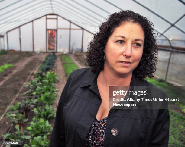 Amy Klein, executive director of the Capital District Community Gardens inside their high tunnel passive solar greenhouse on 8th Street in Troy...