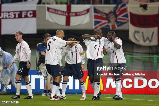 June 15: Rio Ferdinand of England, David Beckham of England, Sol Campbell of England and Emile Heskey of England celebrate during the FIFA World Cup...