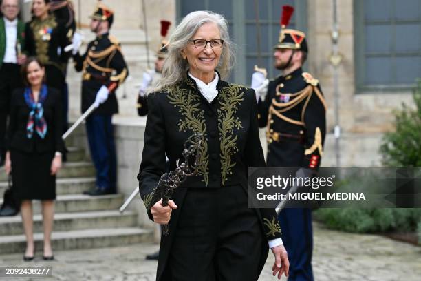 New member of the Academie des Beaux-Art US photographer Annie Leibovitz leaves with her Academician Sword after her induction ceremony as a foreign...