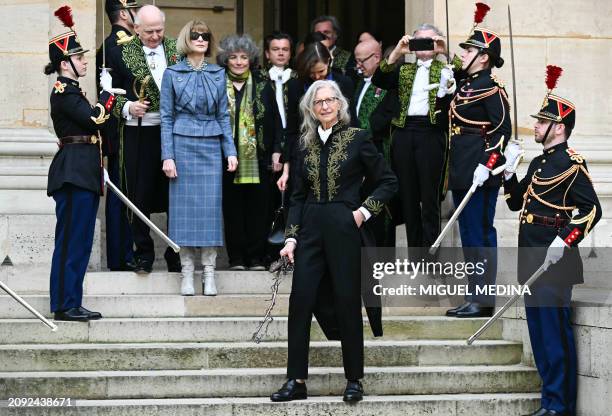 New member of the Academie des Beaux-Art US photographer Annie Leibovitz poses with her Academician Sword in front of French composer and perpetual...