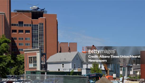 Helicopter flies over Myrtle Avenue to land atop Albany Medical Center on New Scotland Avenue in the city's Park South neighborhood in Albany, NY,...