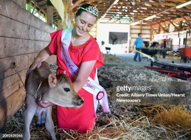 Rensselaer County Dairy Princess Courtney Luskin of Valley Falls with her Jersey calf "Peppermint Pattie" in the 4H Dairy Barn on opening day of the...