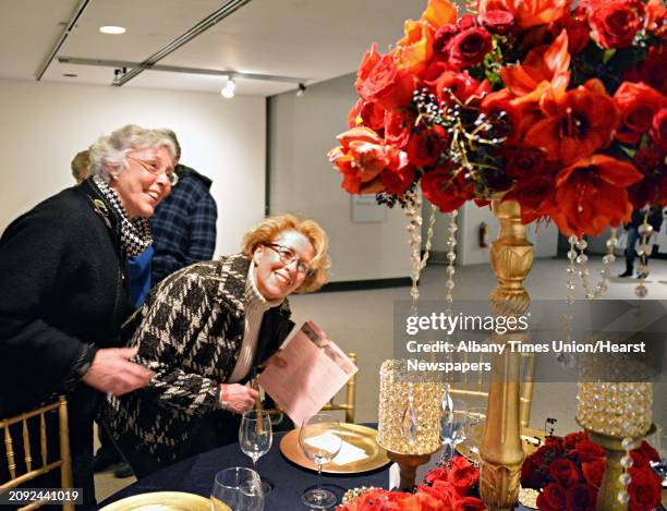 Pat Hartman, left, of Bethlehem and Pat Leary of Old Chatham take a close look at one of the floral exhibits during the New York in Bloom annual...