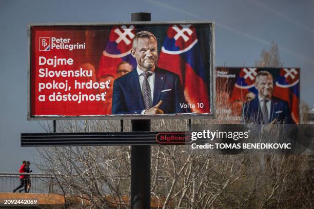 Picture taken on March 20, 2024 shows election billboards of speaker of the parliament, the head of the Hlas party and presidential candidate Peter...