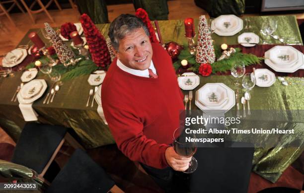 Angelo Mazzone at a table set for guests in the dining room of his home Tuesday Oct. 21 in Rexford, NY. One of his favorite memories is of hosting...