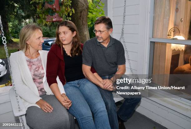 Skidmore freshman Olivia Cox, center, with her parents Ruth and Jeff Cox at their home Saturday Sept. 20 in Niskayuna, NY. The family traveled to...