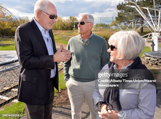 Jeffrey Sperber, left, of Huck Finn's Warehouse with Hoffman's Playland owners David and Ruth Hoffman prior to the announcement of the amusement...