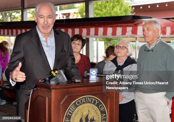 Jeffrey Sperber, left, of Huck Finn's Warehouse announces the move of Hoffman's Playland to property adjacent to Huck Finn's in Albany during a news...