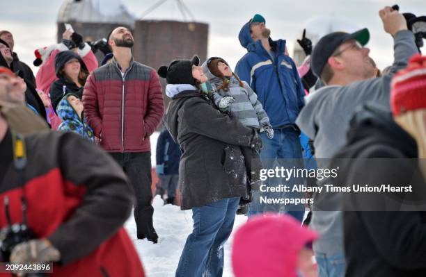 Eager onlookers watch as Santa Claus parachutes onto the EllmsÕ Christmas Tree Farm Saturday Nov. 29, 2014.