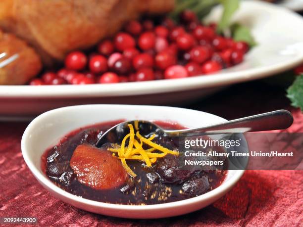 Cranberry sauce with strips of orange zest on a holiday table at Mazzone Hospitality Corporate Headquarters Wednesday Nov. 12 in Clifton Park, NY.