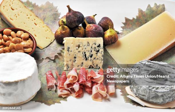 The Cheese Traveler's Valentine's Day cheese platter with, clockwise from top left, Kinsmen Ridge cheese, fresh figs and Forme Moelleux cheese,...