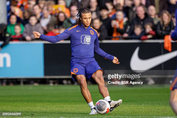 Nathan Ake of The Netherlands makes a pass during the Training session of the Netherlands National Football Team at KNVB Campus on March 18, 2024 in...