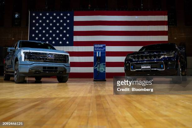 Ford Motor Co. F-150 Lightning, left, and Jeep Grand Cherokee 4xe electric vehicles during an event at the DC Armory in Washington, DC, US, on...