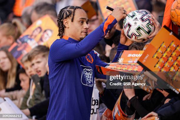 Xavi Simons of The Netherlands signing autographs during the Training session of the Netherlands National Football Team at KNVB Campus on March 18,...