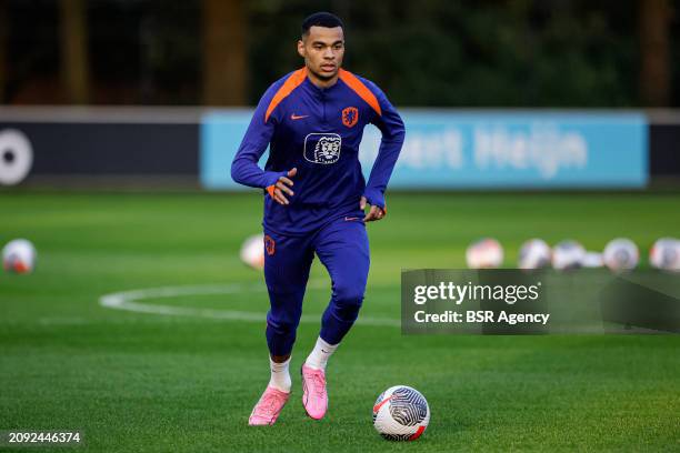 Cody Gakpo of The Netherlands makes a pass during the Training session of the Netherlands National Football Team at KNVB Campus on March 18, 2024 in...