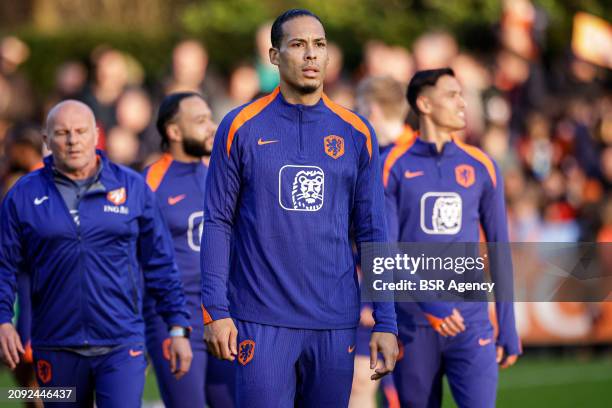 Virgil van Dijk of The Netherlands looks up during the Training session of the Netherlands National Football Team at KNVB Campus on March 18, 2024 in...