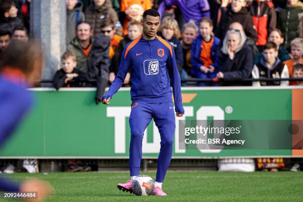 Cody Gakpo of The Netherlands makes a pass during the Training session of the Netherlands National Football Team at KNVB Campus on March 18, 2024 in...
