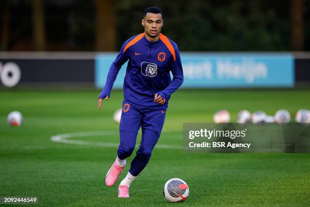 Cody Gakpo of The Netherlands makes a pass during the Training session of the Netherlands National Football Team at KNVB Campus on March 18, 2024 in...