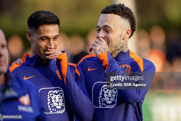 Tijjani Reijnders of The Netherlands, Quilindschy Hartman of The Netherlands talking during the Training session of the Netherlands National Football...